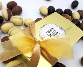 125 gram amb. paaseitjes in gouden doosje met logo - Chocoladebox.nl