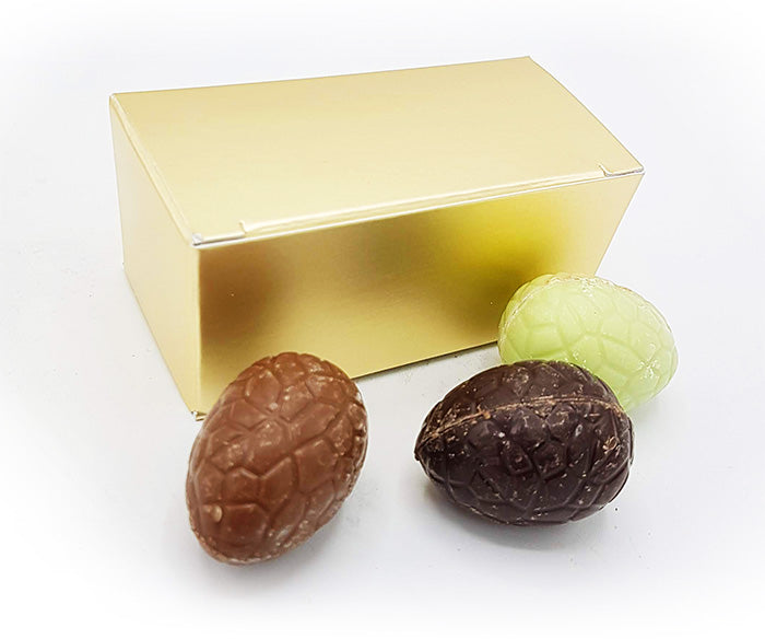 3 handmade Easter eggs in a gold box with its own label