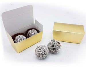 2 coconut truffles in a golden box