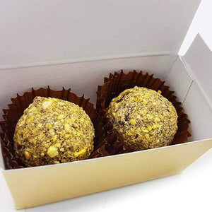 2 Pistachio truffles in a golden box